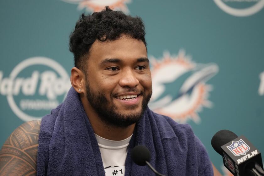 Miami Dolphins quarterback Tua Tagovailoa answers a questions after an NFL football game against the Denver Broncos, Sunday, Sept. 24, 2023, in Miami Gardens, Fla. The Dolphins defeated the Broncos 70-20. (AP Photo/Rebecca Blackwell)