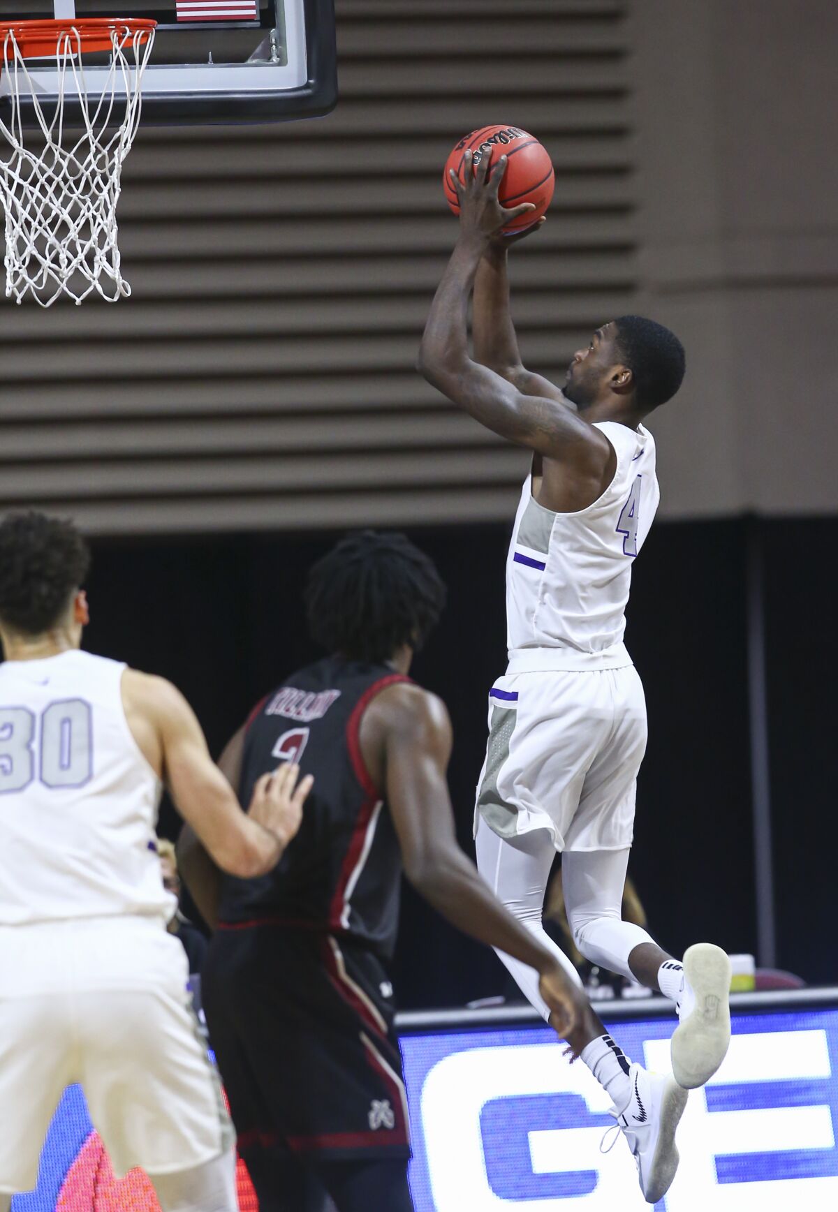 Grand Canyon's Oscar Frayer puts up a shot against New Mexico State.
