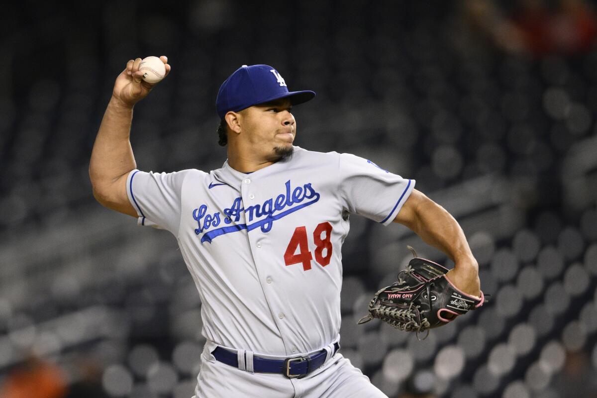 Los Angeles Dodgers relief pitcher Brusdar Graterol throws during the ninth inning of a baseball game.