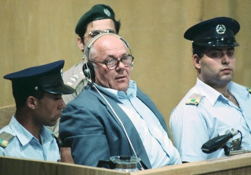 John Demjanjuk, accused of war crimes against humanity, sits in the dock of Israel's supreme court in Jerusalem while being sentenced in April 1988.