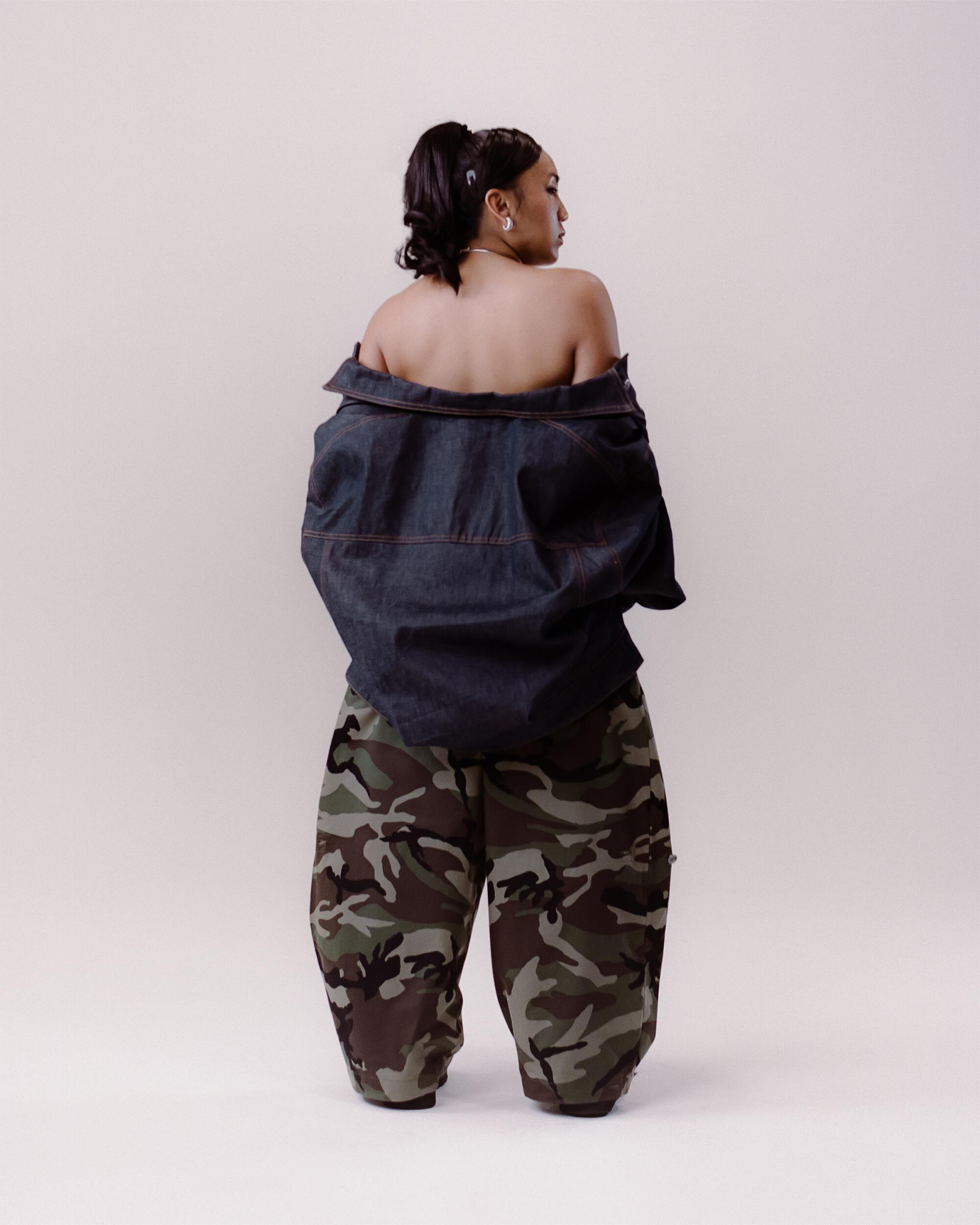 Micah wears Art Community Reversible 7 Pocket Japanese Denim overgarment and Camo Japanese Twill pants, Maaari Lunar collar and