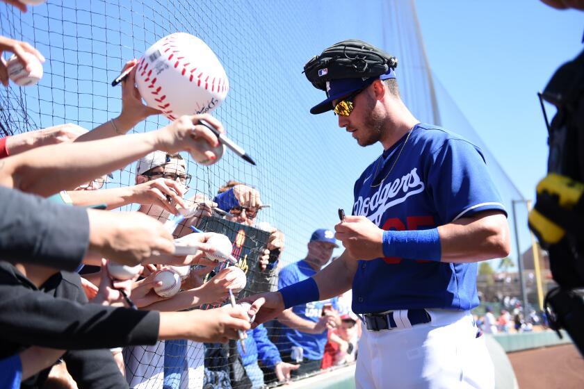 GLENDALE, ARIZONA - FEBRUARY 26: Cody Bellinger #35 of the Los Angeles Dodgers signs autographs prior to a spring training game against the Los Angeles Angels at Camelback Ranch on February 26, 2020 in Glendale, Arizona. (Photo by Norm Hall/Getty Images)