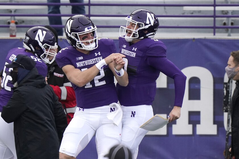 Northwestern's Peyton Ramsey celebrates with Carl Richardson during a game against Wisconsin.