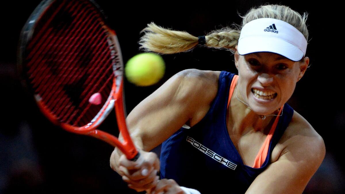 Angelique Kerber hits a return during her victory over Caroline Wozniacki at the Porsche Grand Prix final on Sunday.