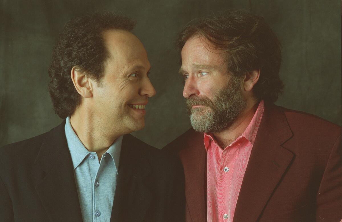 Billy Crystal, left, and Robin Williams together in 1997 to promote their movie "Father's Day."