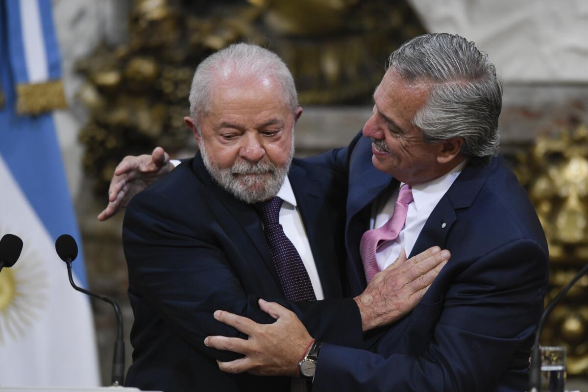 Brazil's President Luiz Inacio Lula da Silva and Argentina's President Alberto Fernández embrace.