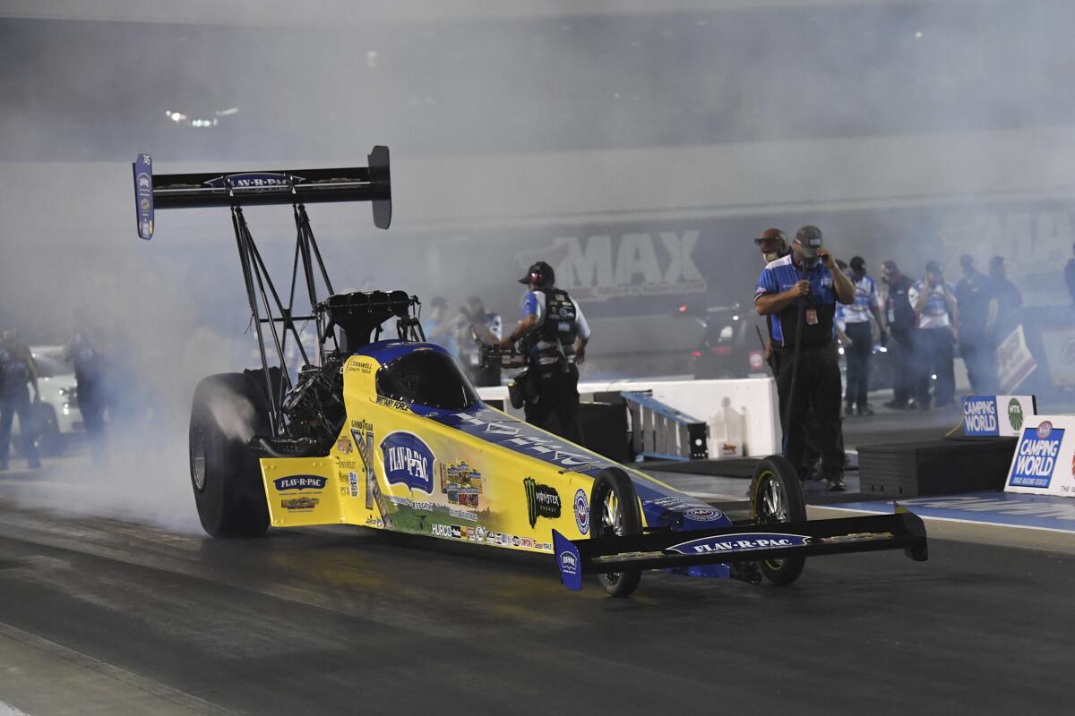 In this photo provided by the NHRA, Brittany Force takes part in Top Fuel qualifying Friday, May 14, 2021, at the NGK NTK NHRA Four-Wide Nationals drag races in Concord, N.C. (Richard H Shute/NHRA via AP)