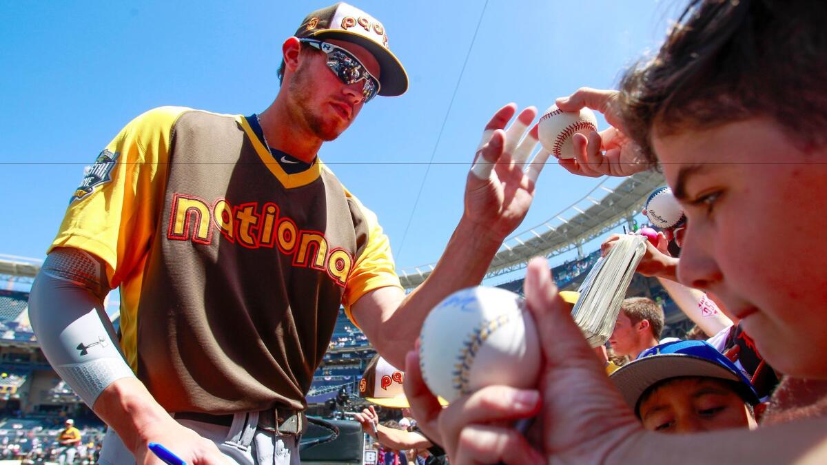 The Padres' Wil Myers signs autographs for fans before the start of the All-Star Game at Petco Park.