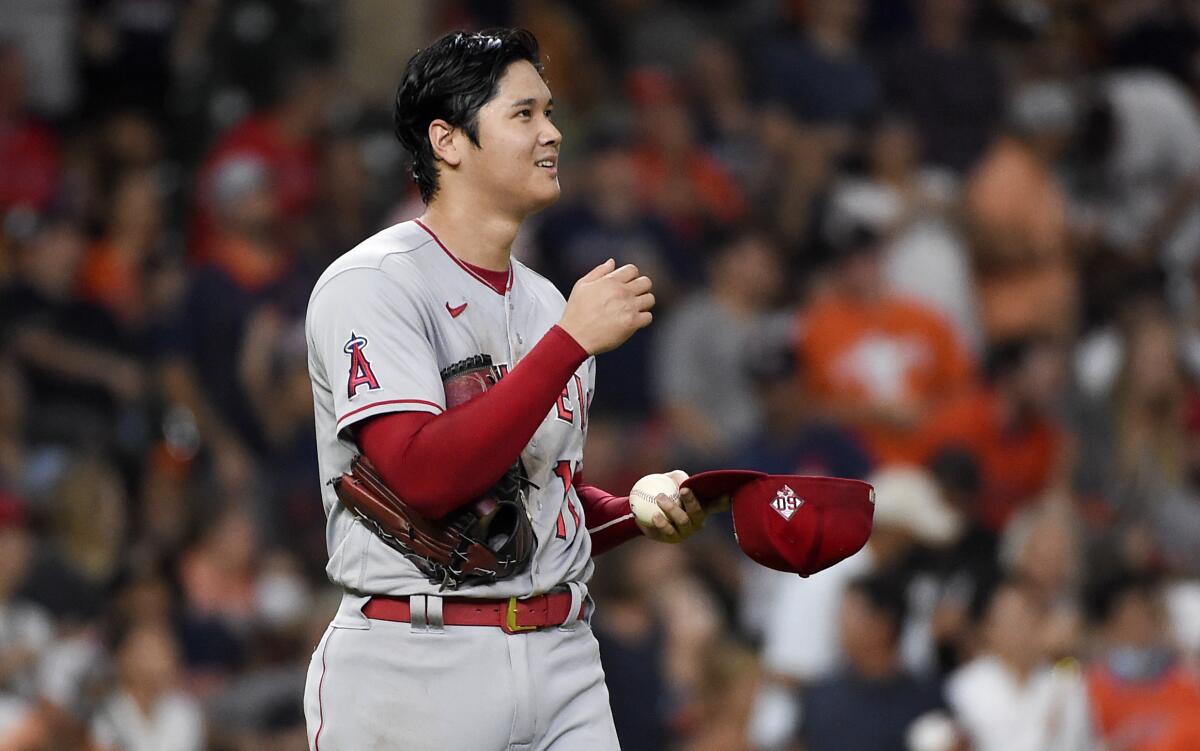 Angels pitcher Shohei Ohtani reacts after an RBI double by the Astros' Yordan Alvarez during the third inning Sept. 10, 2021.