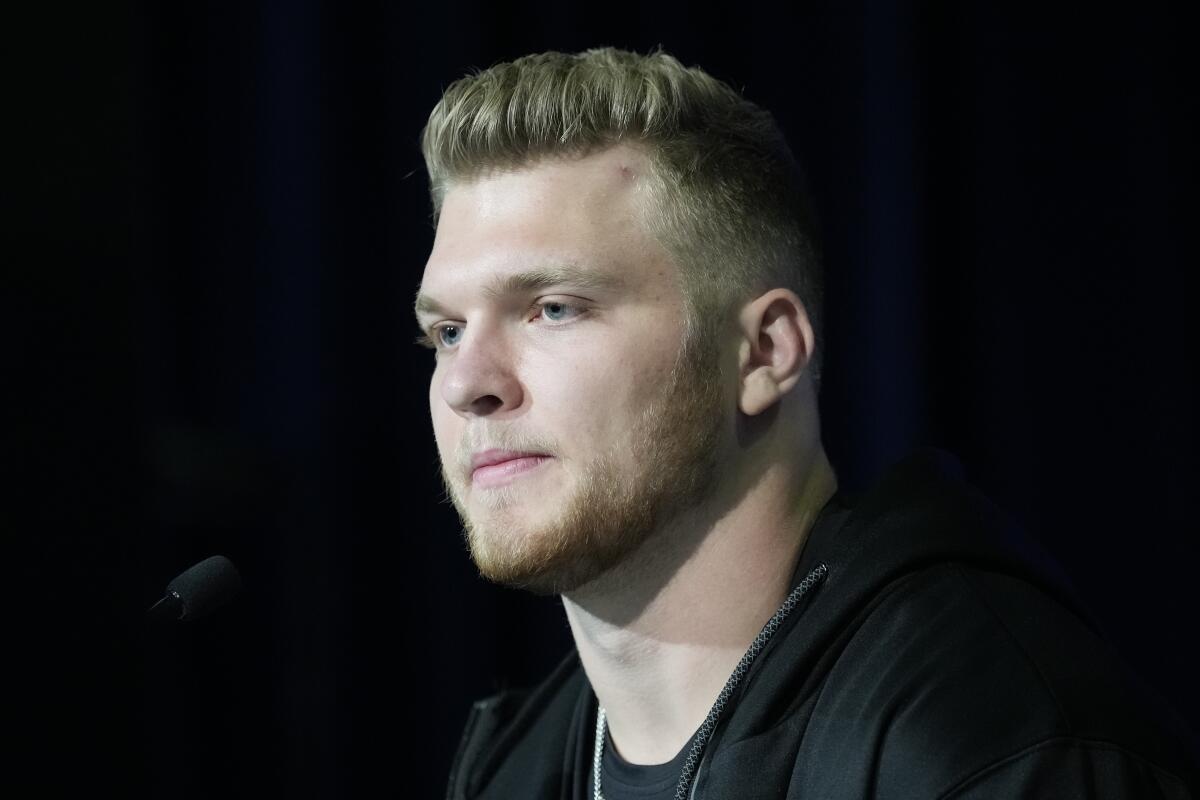 Michigan defensive lineman Aidan Hutchinson speaks during a press conference at the NFL football scouting combine in Indianapolis, Friday, March 4, 2022. (AP Photo/AJ Mast)