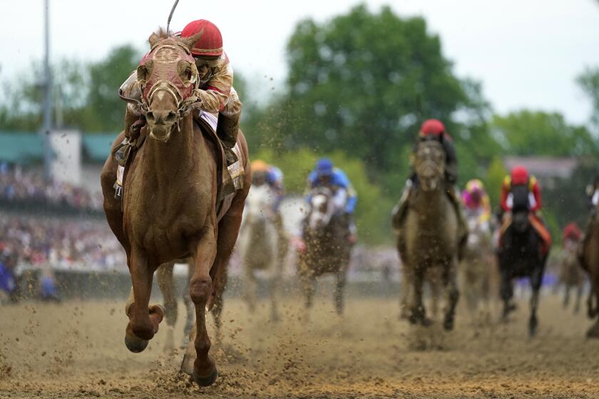 Rich Strike, with Sonny Leon aboard, wins the 148th running of the Kentucky Derby horse race at Churchill Downs Saturday, May 7, 2022, in Louisville, Ky. (AP Photo/Jeff Roberson)