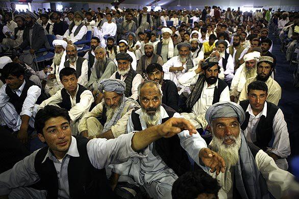 A crowd gathers in a large, hot tent in Kabul to show support for President Hamid Karzi, who did not appear. Until recently, Karzai spent little time in public, leaving the campaigning to aides and surrogates.