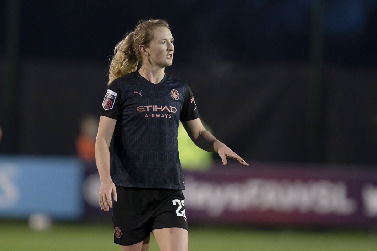 FILE - Sam Mewis, then of Manchester City Women, stands on the field during an FA WSL soccer match against Everton Ladies at Walton Hall Park Stadium in Liverpool, England, Dec. 6, 2020. Mewis, who plays for the Kansas City Current of the National Women's Soccer League, has undergone a second knee surgery and likely won't be available to play in the Women's World Cup this summer. (AP Photo/Jon Super, File)
