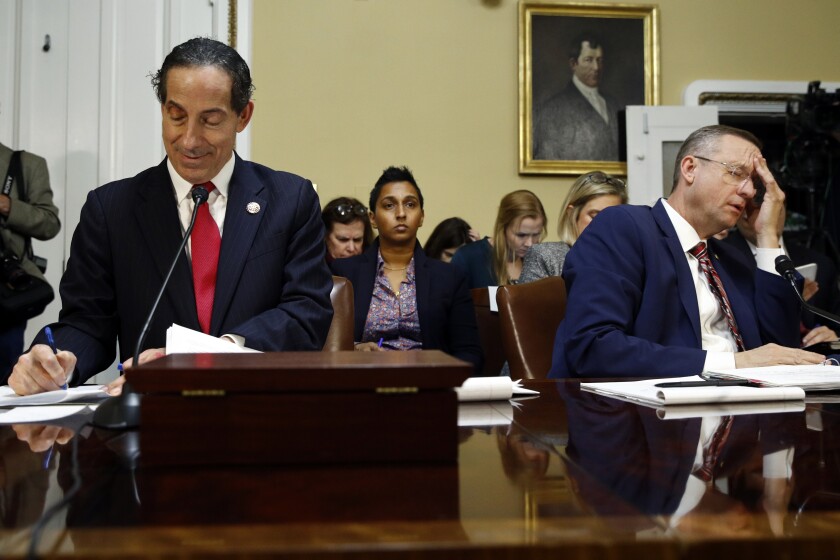Rep. Jamie Raskin (D-Md.), left, and Rep. Doug Collins (R-Ga.) appeared before the House Rules Committee on the eve of the impeachment vote.