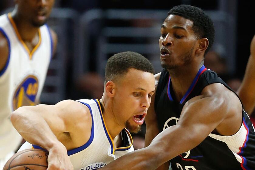 The Clippers' C.J. Wilcox, right, guards Golden State's Stephen Curry in February.