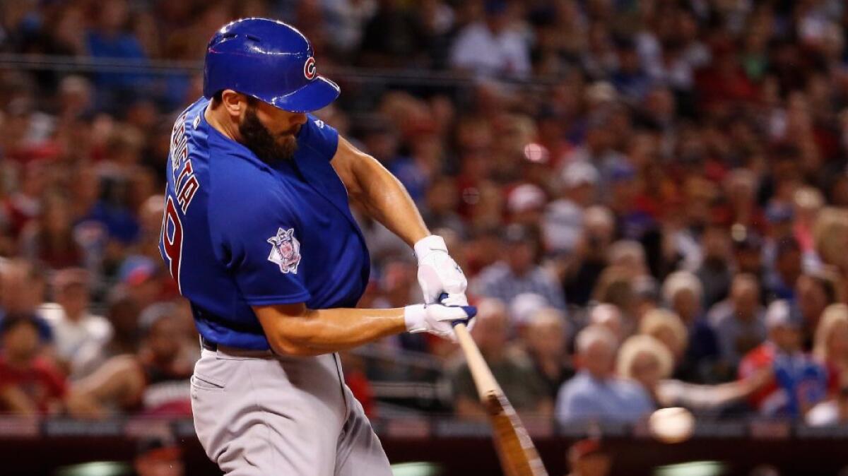 Cubs ace Jake Arrieta hits a two-run home run against the Diamondbacks during a game on April 10.