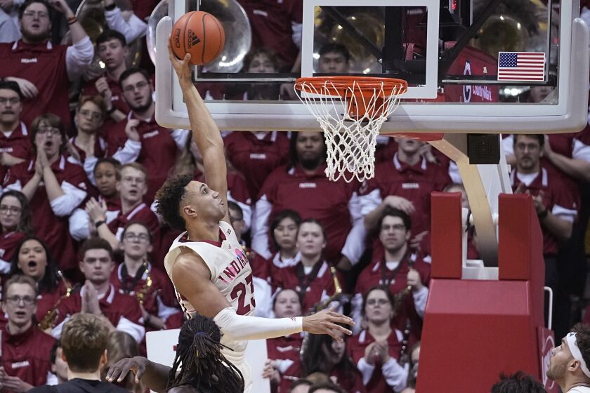 Indiana forward Trayce Jackson-Davis (23) dunks during the first half of the team's NCAA college basketball game against Rutgers, Tuesday, Feb. 7, 2023, in Bloomington, Ind. (AP Photo/Darron Cummings)