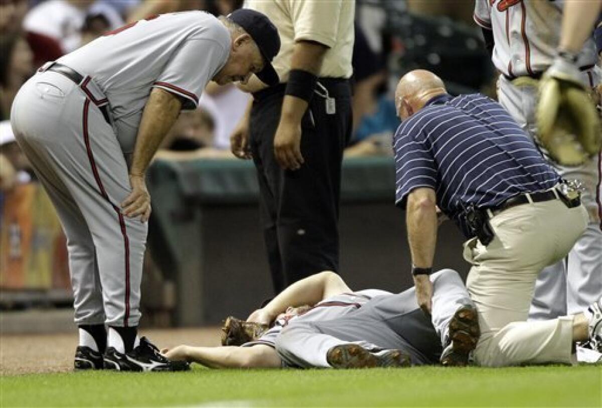 Atlanta Braves hitting consultant Chipper Jones (10) watches