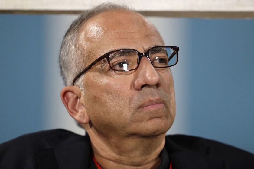 FILE - In this Oct. 10, 2017, file photo, Carlos Cordeiro, vice president of U.S. Soccer, watches warmups from the team bench ahead of the start of the U.S.'s final World Cup qualifying match against Trinidad and Tobago at Ato Boldon Stadium in Couva, Trinidad. Cordeiro has been elected president of the U.S. Soccer Federation on Saturday, Feb. 10, 2018, assuming control of an organization that must chart a new course after its men's team failed to qualify for this year's World Cup. (AP Photo/Rebecca Blackwell, File)