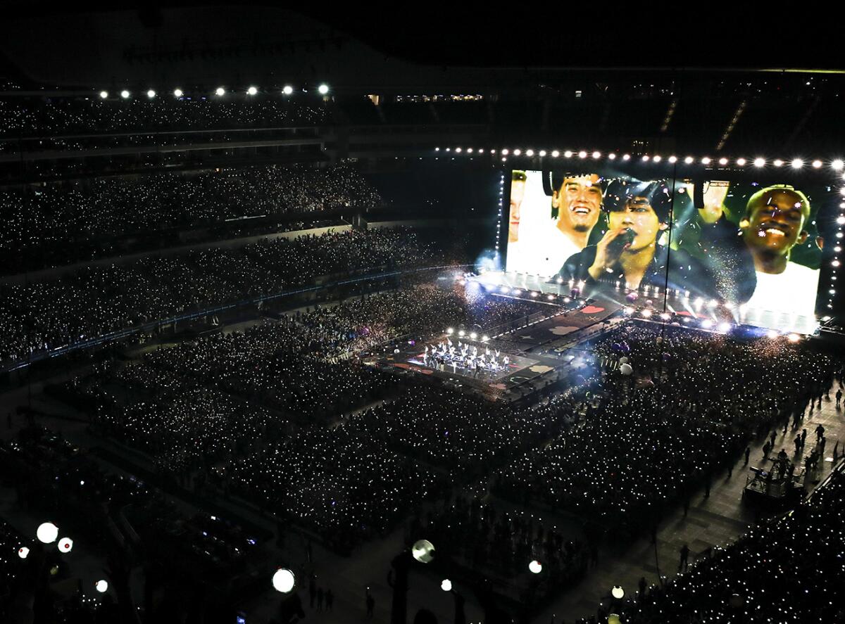 A giant screen at BTS' concert in Inglewood.