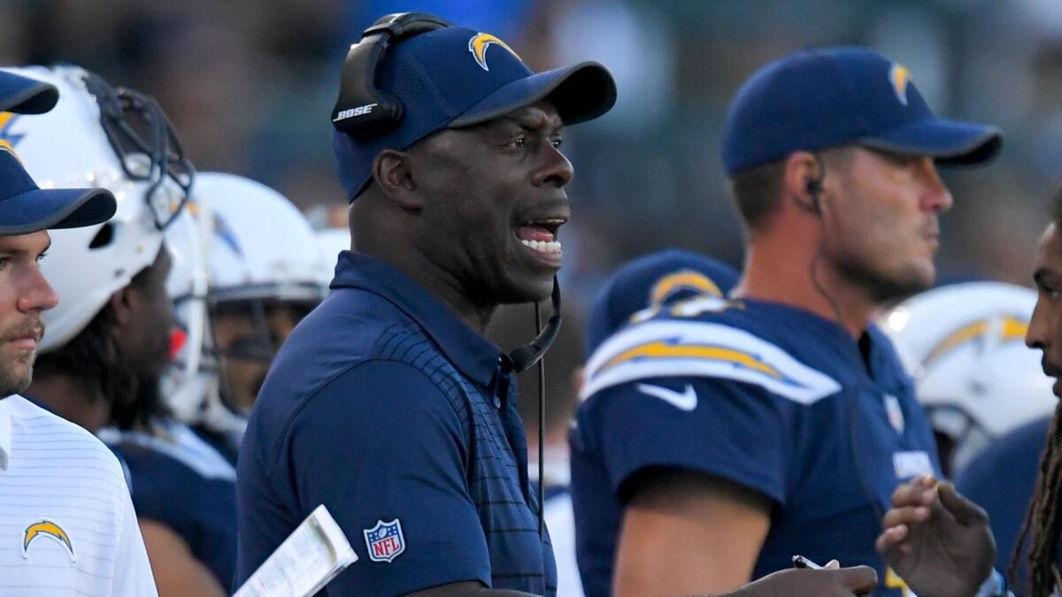 Chargers coach Anthony Lynn yells instruction during a preseason game against the Saints.