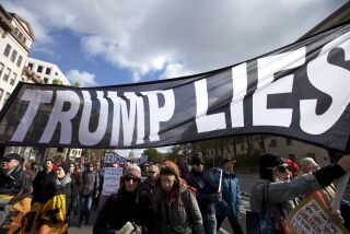 Demonstrators march on Pennsylvania Avenue protesting against climate policies and to impeach President Donald Trump, in Washington, Friday, Nov. 8, 2019. (AP Photo/Jose Luis Magana)