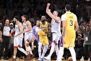 LOS ANGELES, CA - MAY 22: Los Angeles Lakers forward LeBron James, center, reacts after losing game.