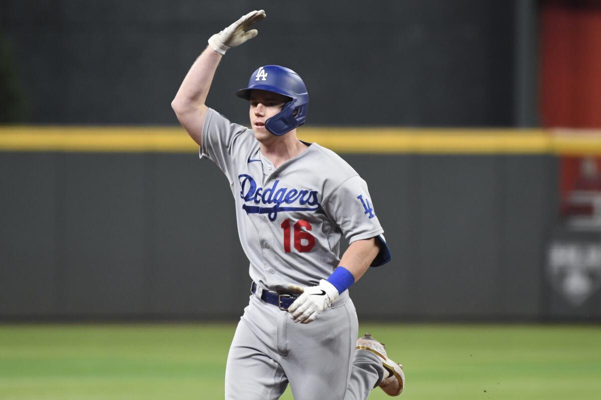 Will Smith celebrates as he rounds the bases after hitting a solo home run in the fourth inning.