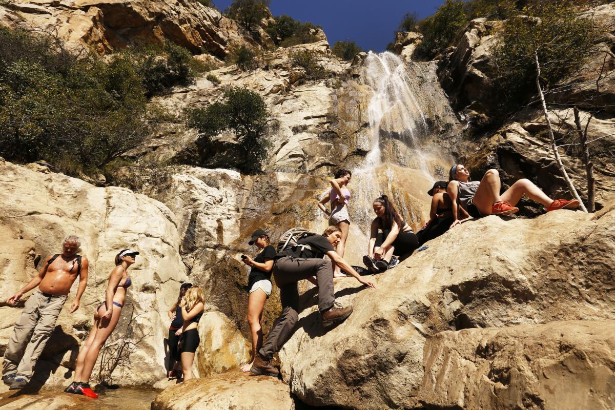 Local hikers from Santa Barbara and Goleta climb to the bottom of Tangerine Falls located on the west fork of cold Springs Trail in the Santa Ynez Mountains. It's described as an adventurous rock-hopping trail, not for the faint of heart.