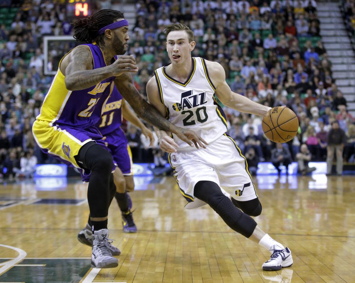 Lakers center Jordan Hill guards Utah Jazz forward Gordon Hayward during a game Feb. 25 in Salt Lake City.