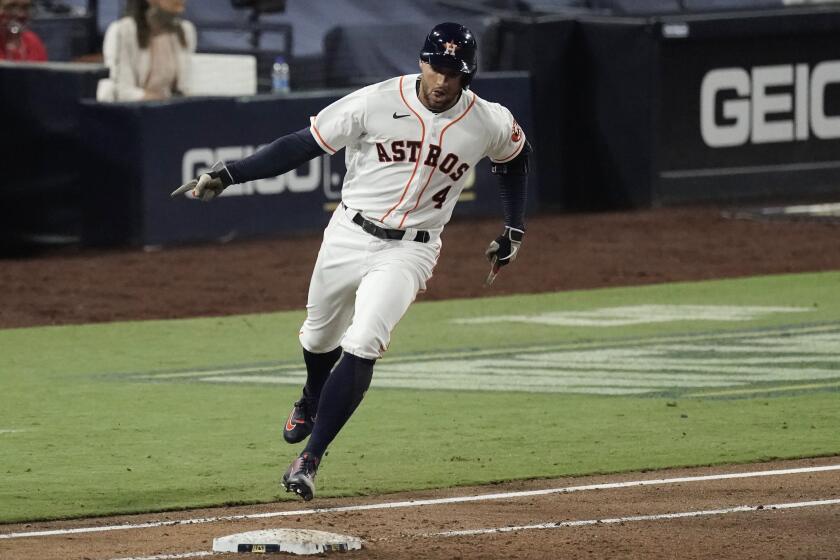 Houston Astros George Springer rounds the bases after hitting a two run home run against the Tampa Bay Rays during the fifth inning in Game 4 of a baseball American League Championship Series, Wednesday, Oct. 14, 2020, in San Diego. At right is Tampa Bay Rays catcher Mike Zunino. (AP Photo/Jae C. Hong)