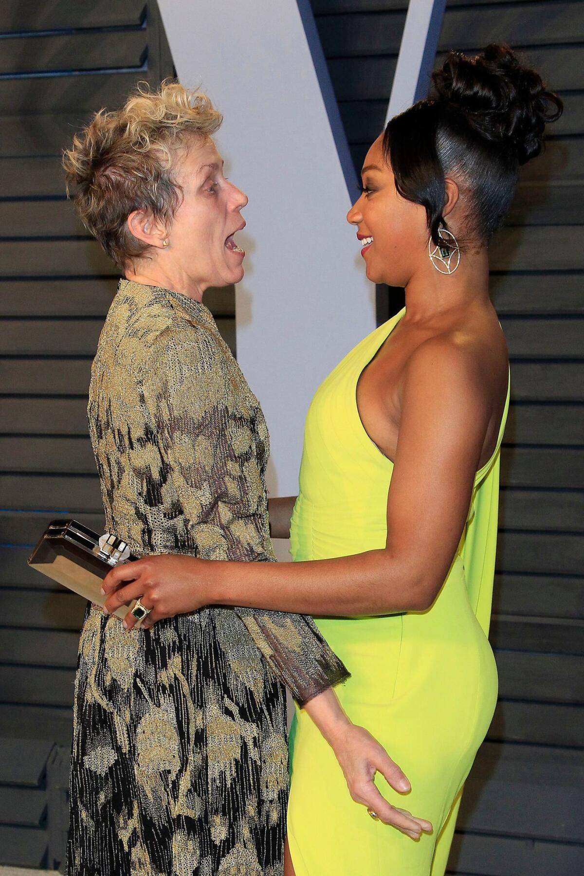 Frances McDormand tells Tiffany Haddish all about the theft of her Oscar at the entrance to the Vanity Fair Oscar party after the 90th Academy Awards.