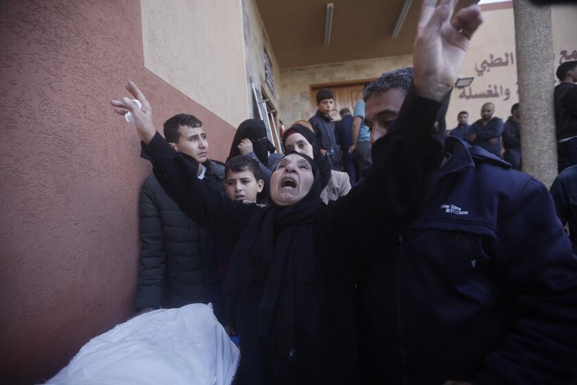 Palestinians attend a funeral of their relatives killed in the Israeli bombardment of the Gaza Strip in Khan Younis, Wednesday, Dec. 6, 2023. (AP Photo/Mohammed Dahman)