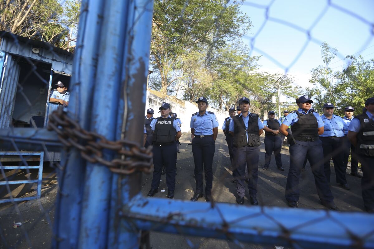 Police stand guard at a holding center known as El Chipote in Nicaragua.