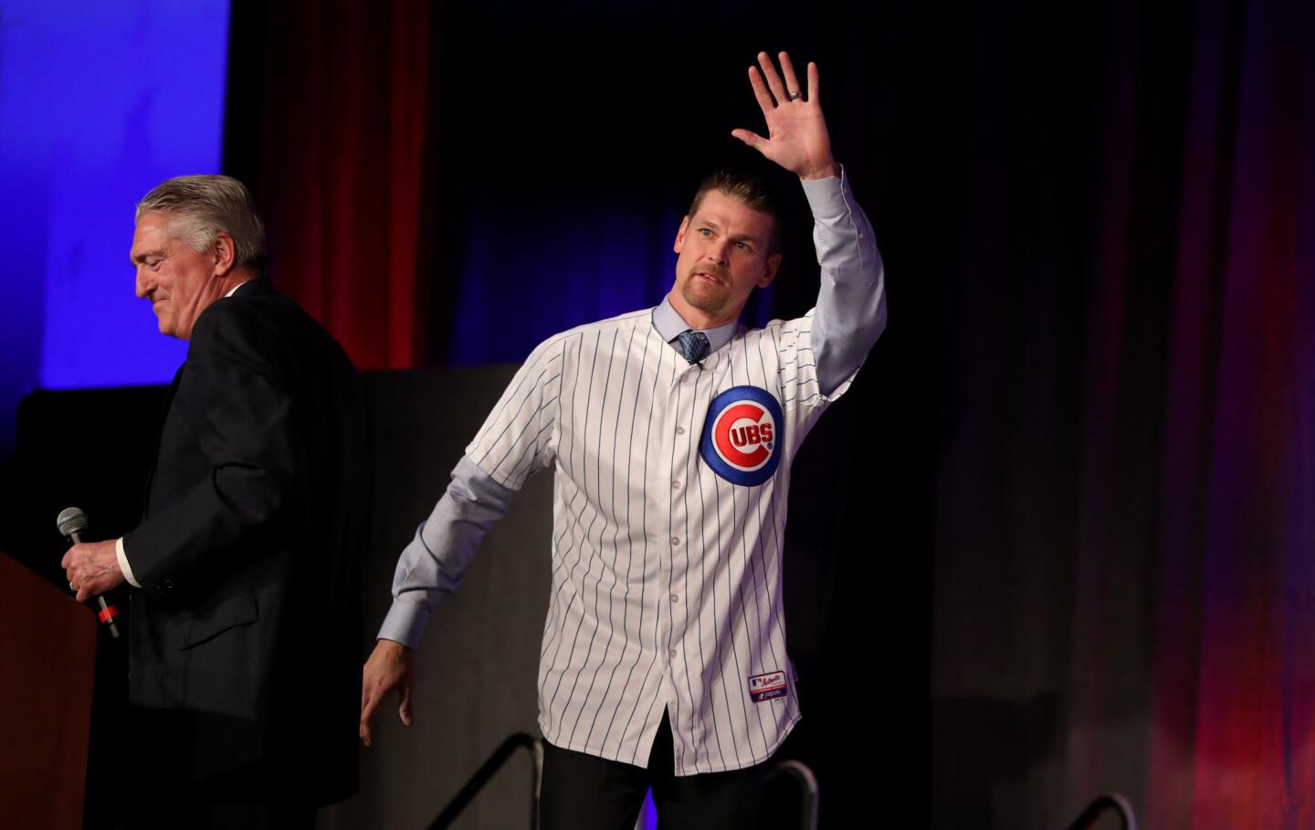 Kerry Wood waves to the crowd as former and current members of the organization are introduced to fans on the first day of the annual Cubs Convention on Jan. 12, 2018.