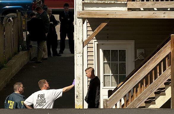 FBI agents search the home of Faisal Shahzad in Bridgeport, Conn., after Shahzad was arrested in connection with Saturday's Times Square bombing attempt.