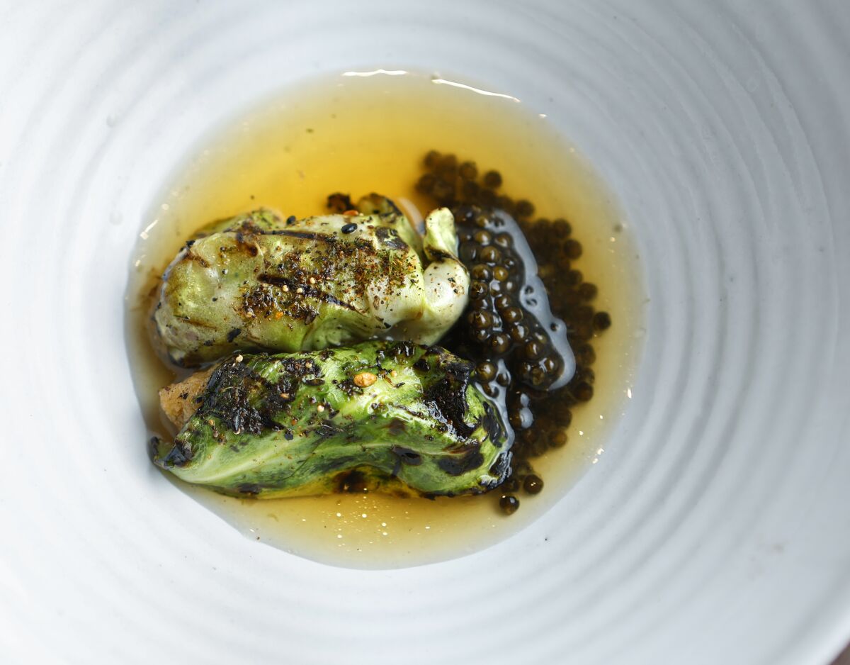 Chef William Eick's grilled cabbage gyoza (dumpling) with caviar at Matsu restaurant in Oceanside.