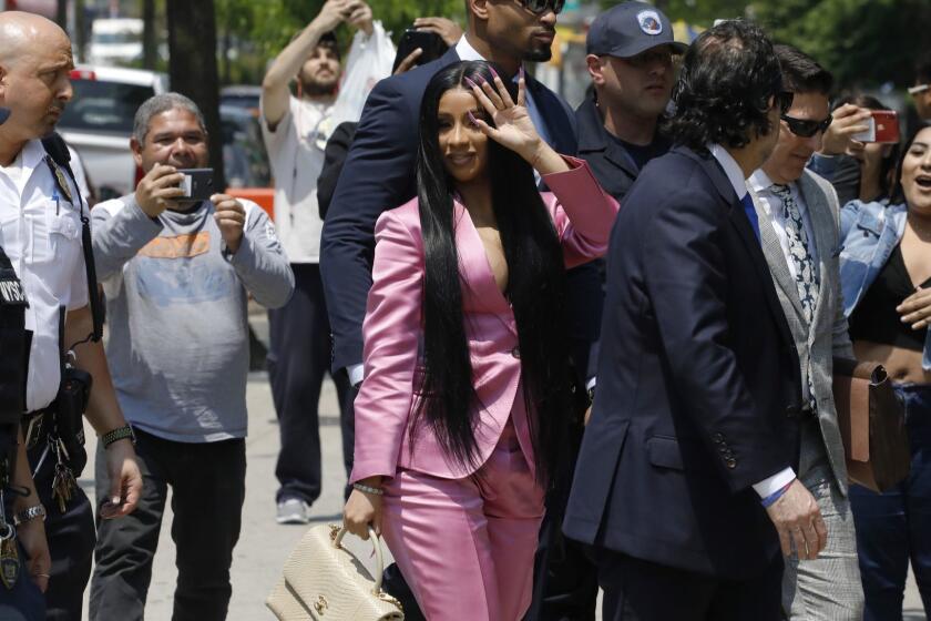 Cardi B arrives at Queens Criminal Court, Friday, May 31, 2019, in New York. Police say Cardi B, whose real name is Belcalis Almanzar, and her entourage were at a nightclub last fall when she argued with a bartender. They say a fight broke out in which chairs, bottles and hookah pipes were thrown, slightly injuring the woman and another employee. She has been charged with misdemeanor reckless endangerment and assault. (AP Photo/Mark Lennihan)
