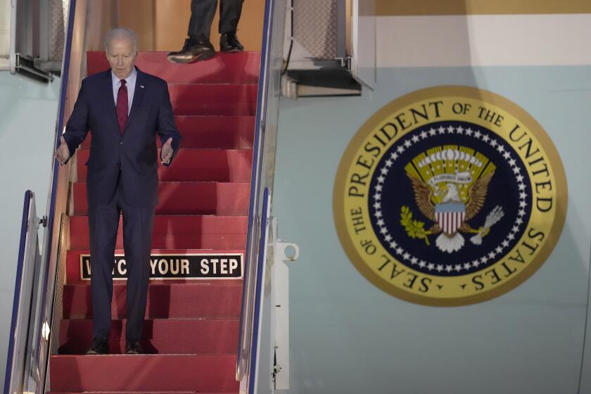 US President Joe Biden walks down the steps of Air Force One as he arrives at Stansted Airport in Stansted, England, Sunday, July 9, 2023. President Biden visits the UK on his way to a NATO summit in Lithuania. (AP Photo/Kin Cheung)
