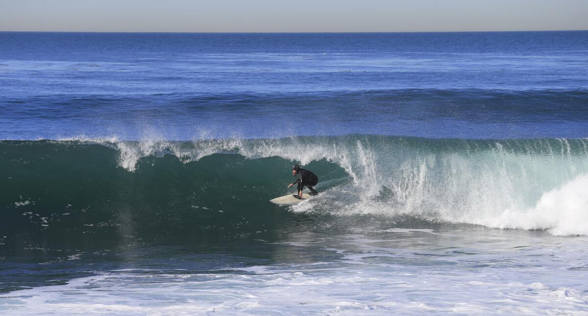 A surfer at Lunada Bay 