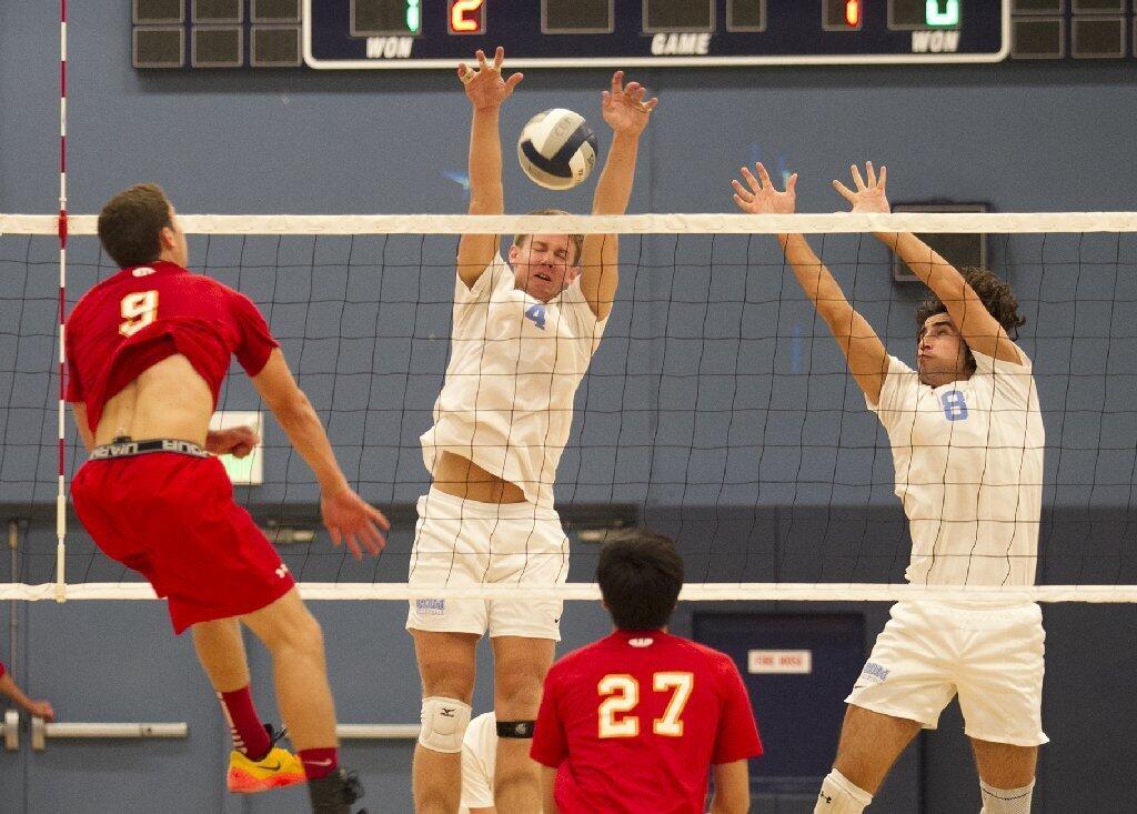 Corona del Mar High's Matt Ctvrtlik (4) and Will Hunter (8) team up for a block against Cathedral Catholic.