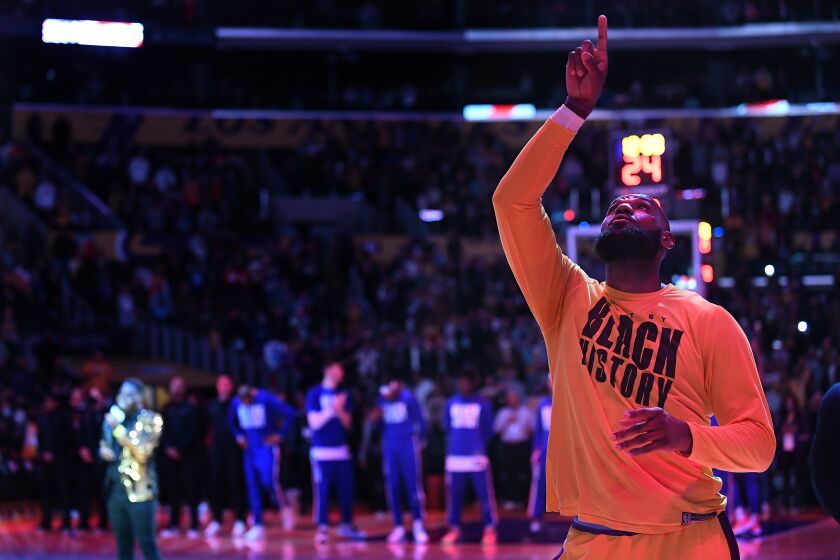 LOS ANGELES-CA-FEBRUARY 25, 2022: Los Angeles Lakers' LeBron James is photographed during the national anthem before a game against the Clippers at Crypto.com Arena in downtown Los Angeles on Friday, February 25, 2022. (Christina House / Los Angeles Times)