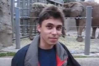 YouTube co-founder Jawed Karim stands in front of the elephant exhibit at the San Diego Zoo on April 23, 2005.