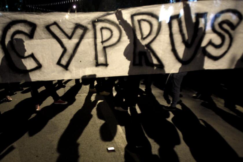 Protesters hold an anti-bailout rally in Nicosia, Cyprus.