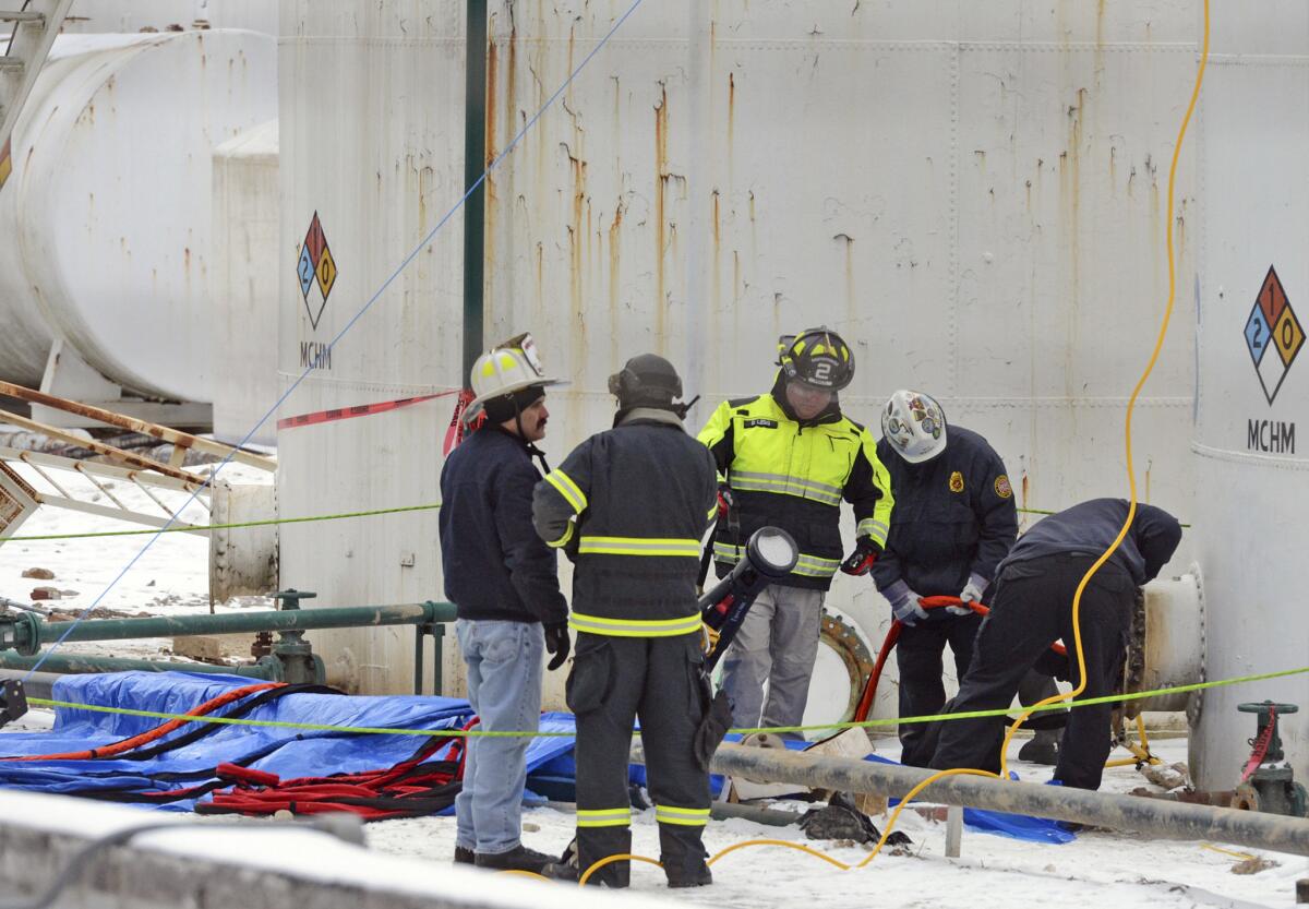 Investigators with the FBI and local fire departments inspect the Freedom Industries site in West Virginia in January.