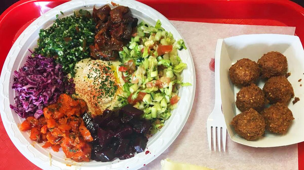 A plate of salads and an order of falafel from Falafel Bar in Woodland Hills.