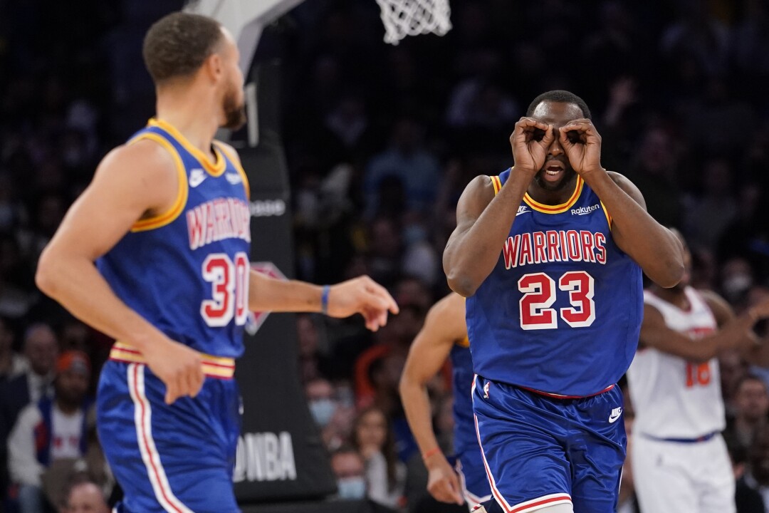 Golden State Warriors forward Draymond Green celebrates a no look pass by Stephen Curry during the second half 