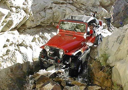 MOTOR SPORT: Members of the West Coast Four Wheel Drive Club traversed Surprise Canyon until 2001, when it was closed. Until then, drivers moved boulders and pruned trees to open a rough roadway.