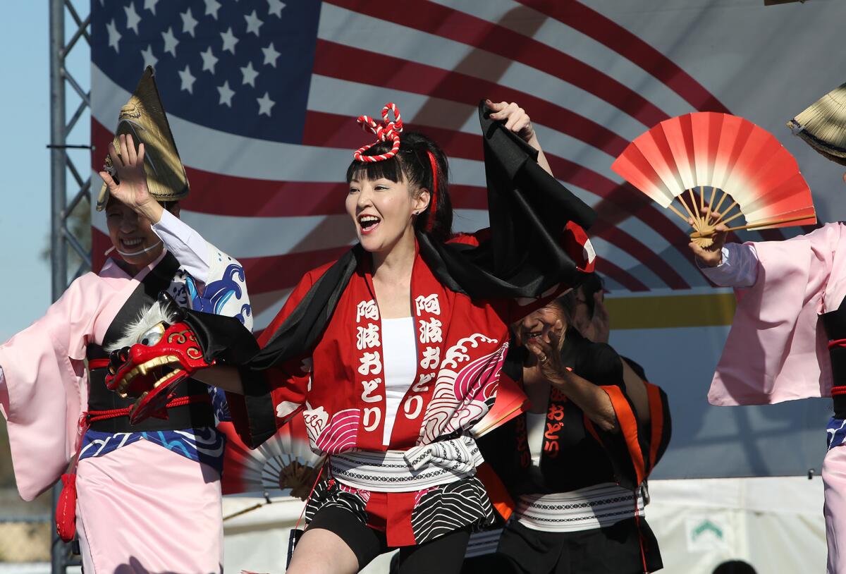 A member of the Awaodori dance troupe performs during the 2018 OC Japan Fair. The event returns to the OC Fair & Event Center in Costa Mesa starting Friday.