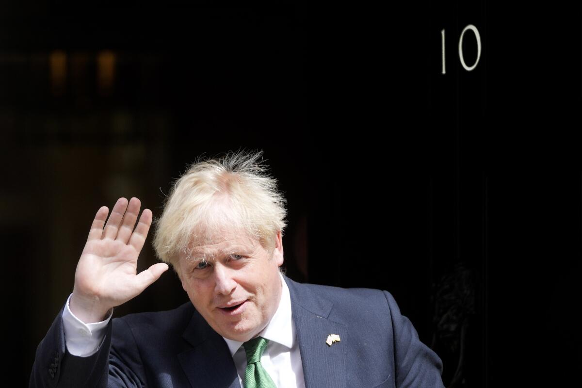 Britain's Prime Minister Boris Johnson waves.